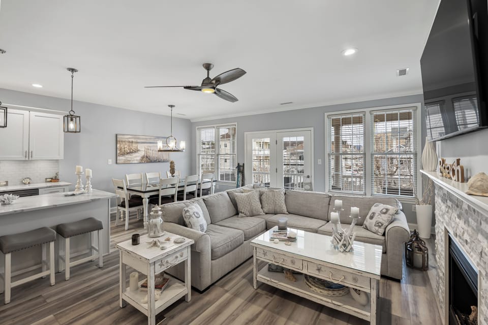 View of the living room, dining area and kitchen island
