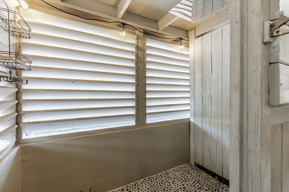 Outdoor shower in the screened in patio.