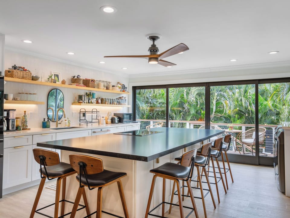Newly remodeled kitchen is stylish, functional. 10' island with seating for 6-8.