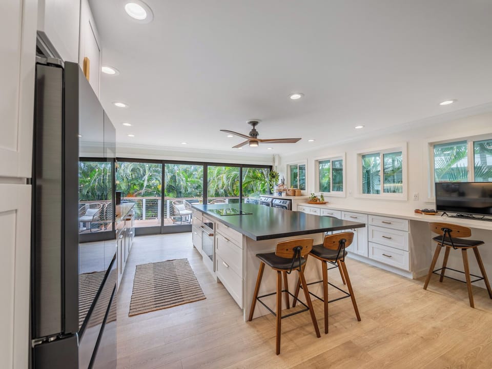 Newly remodeled kitchen is stylish, functional. 10' island with seating for 6-8.