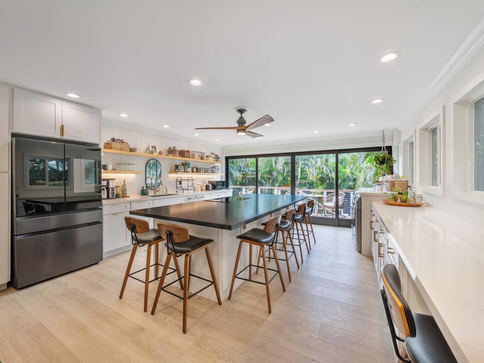 Newly remodeled kitchen is stylish, functional. 10' island with seating for 6-8.