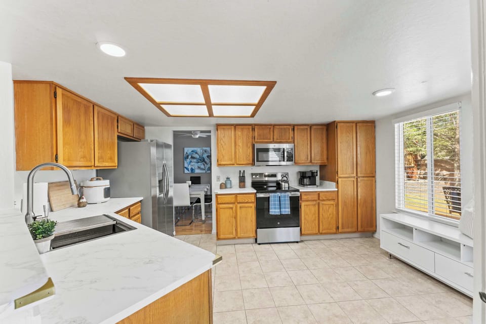 Full kitchen with natural light and room to cook.