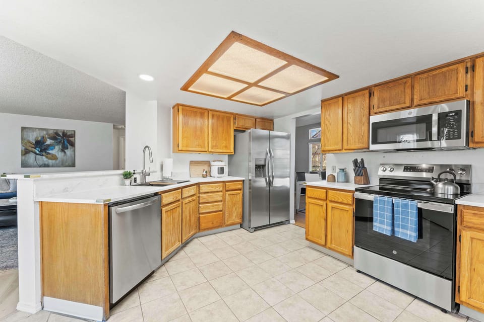 Cook, connect, and create memories in this bright and functional kitchen setup. 