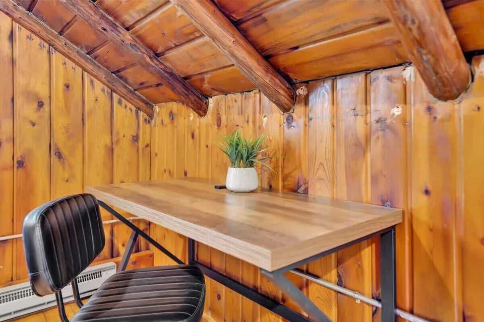 Rustic Cabin Workspace with Wood Walls and Desk