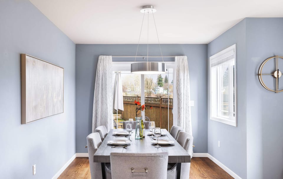 The dinning area is bathed in natural light from large slide door.