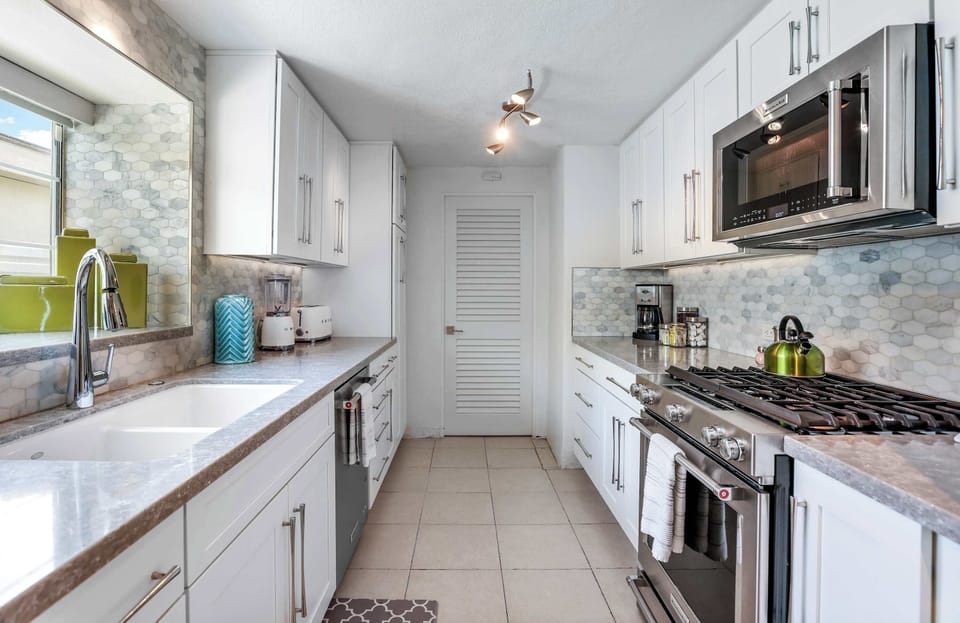The airy kitchen offers ample space & all the comforts of home