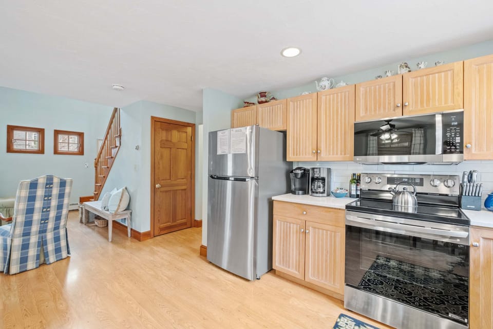 Your inner chef will love this bright kitchen, outfitted with quartz countertops, stainless steel appliances, and all the tools needed for effortless vacation cooking.