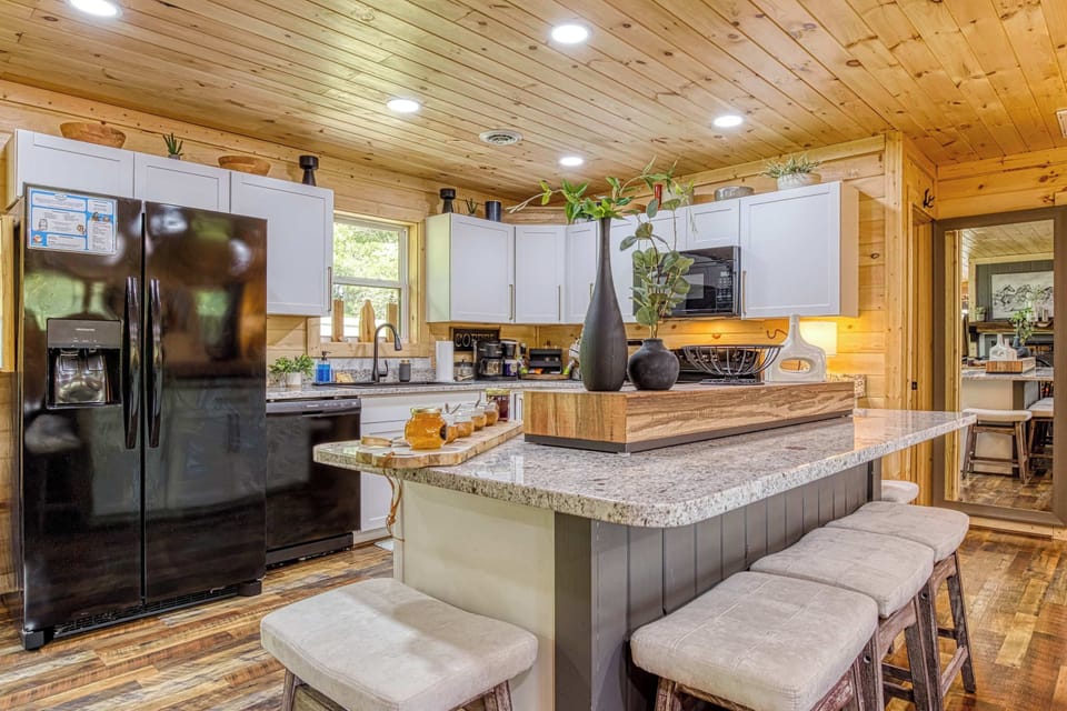 Pull up a seat at the kitchen bar—the perfect spot for morning coffee or evening chats.