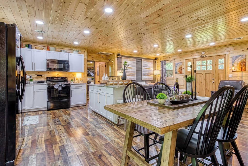 The dining room and kitchen blend effortlessly for easy entertaining and gathering.