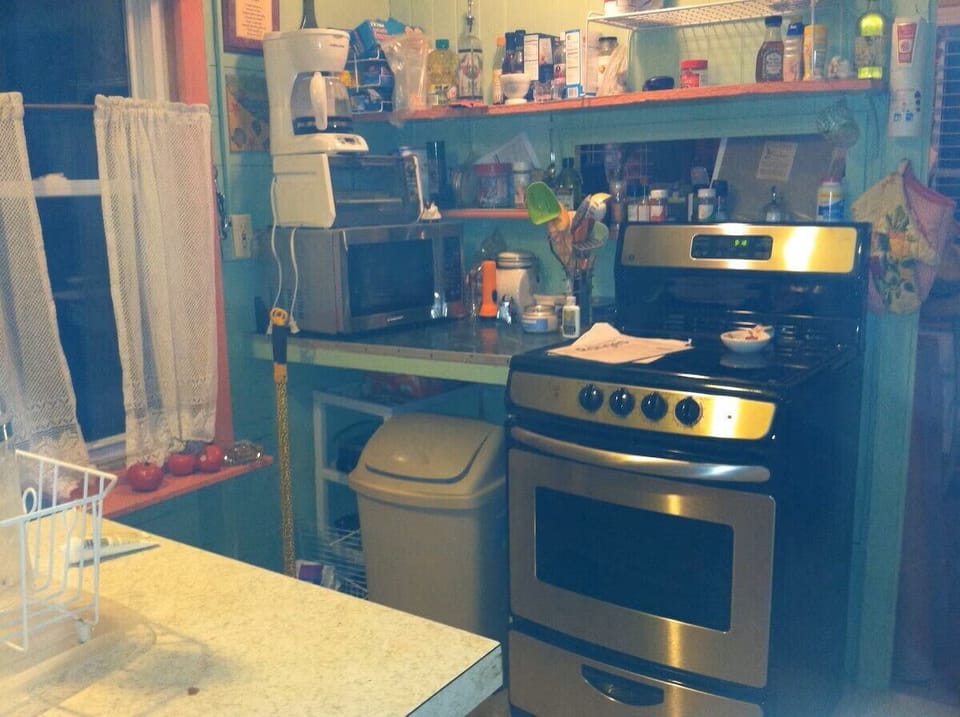  The cozy kitchen is thoughtfully equipped with everything you need. 
