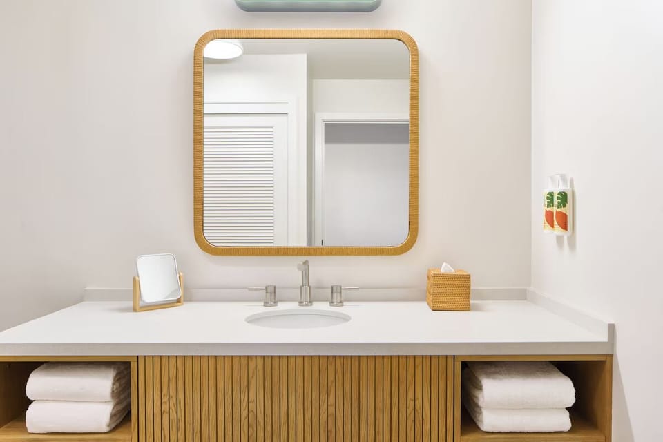 Start the day with soft lighting and spa-style finishes.