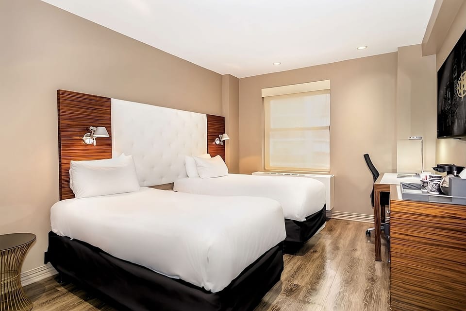 Stretch out on double beds in a calm, modern room.