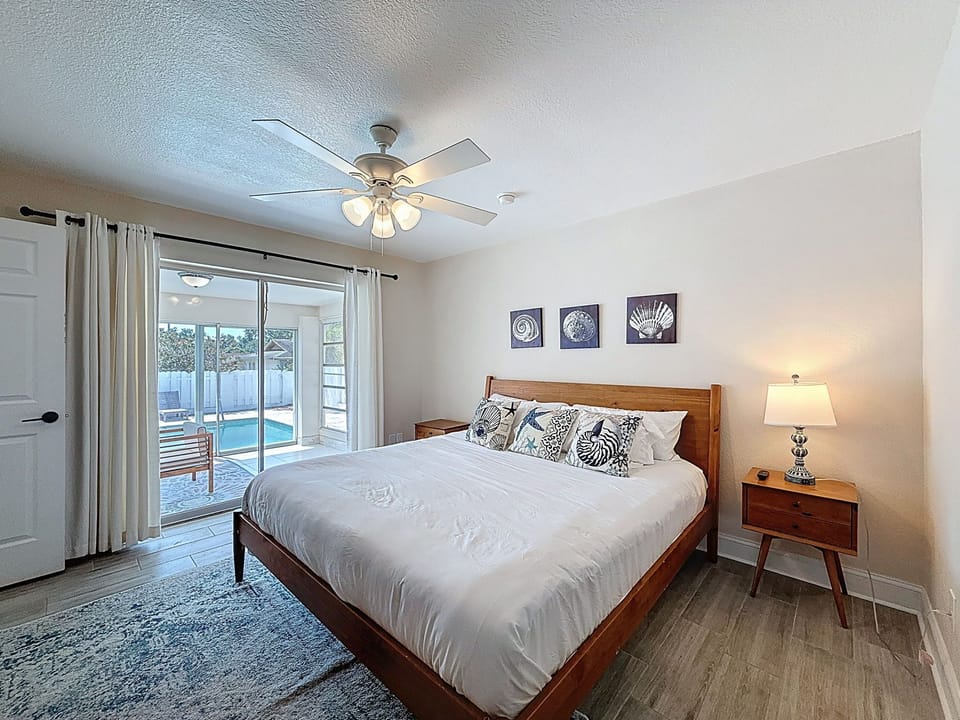 Primary Bedroom with sliders to outdoor patio with pool access