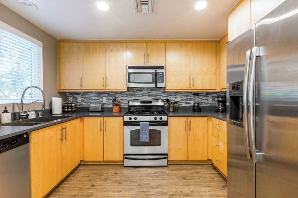 Step into a fully equipped kitchen designed for effortless vacation living.