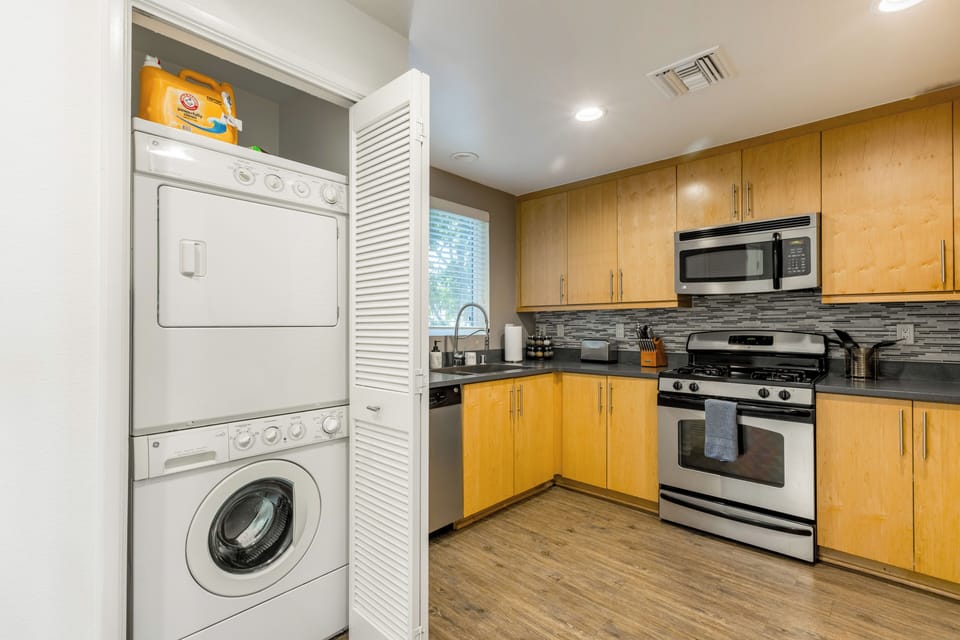 Tucked behind louvered doors is your private in-unit laundry station.
