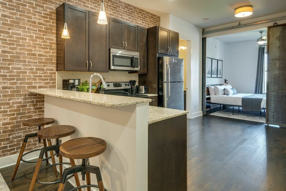 Unit 2: Fully equipped kitchen stocked with your basic cooking essentials. Complete with granite counter tops, stainless steel appliances, and breakfast bar seating.