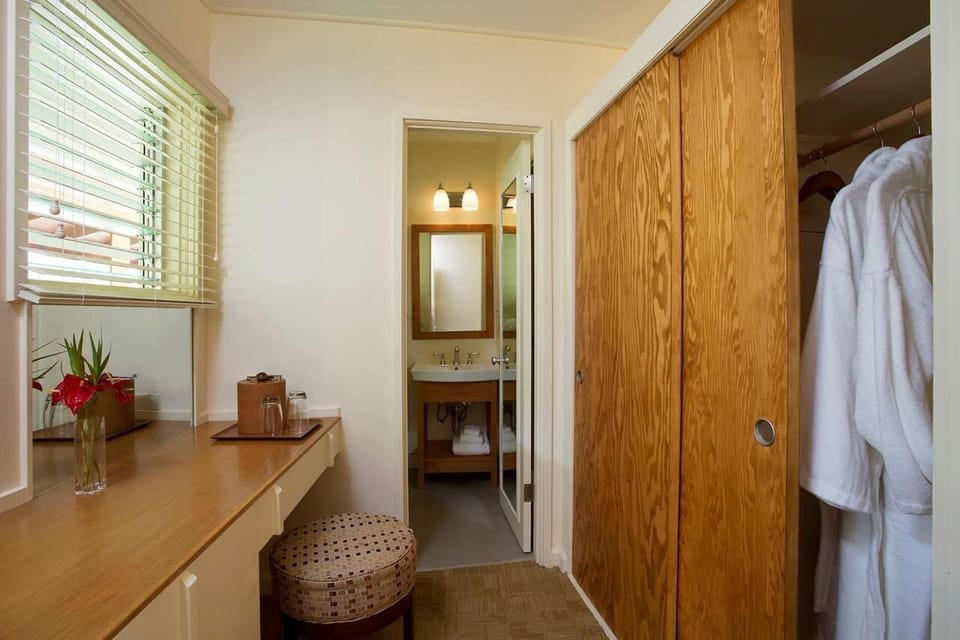 Get ready with a dedicated vanity, closet storage, and soft lighting