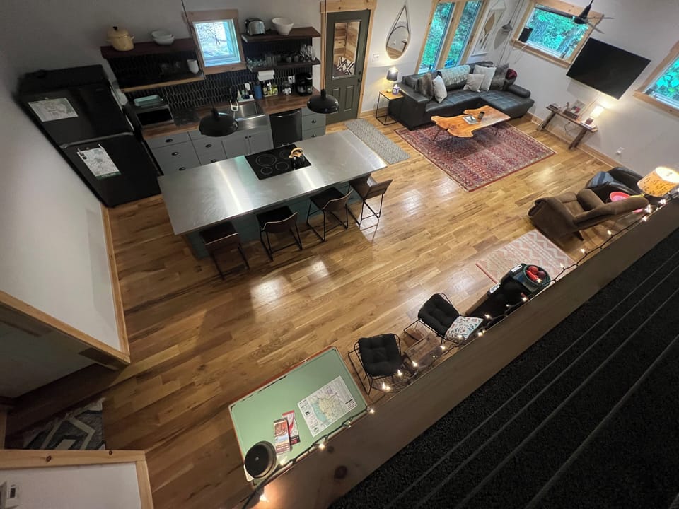 View from the loft down into the kitchen and custom central island