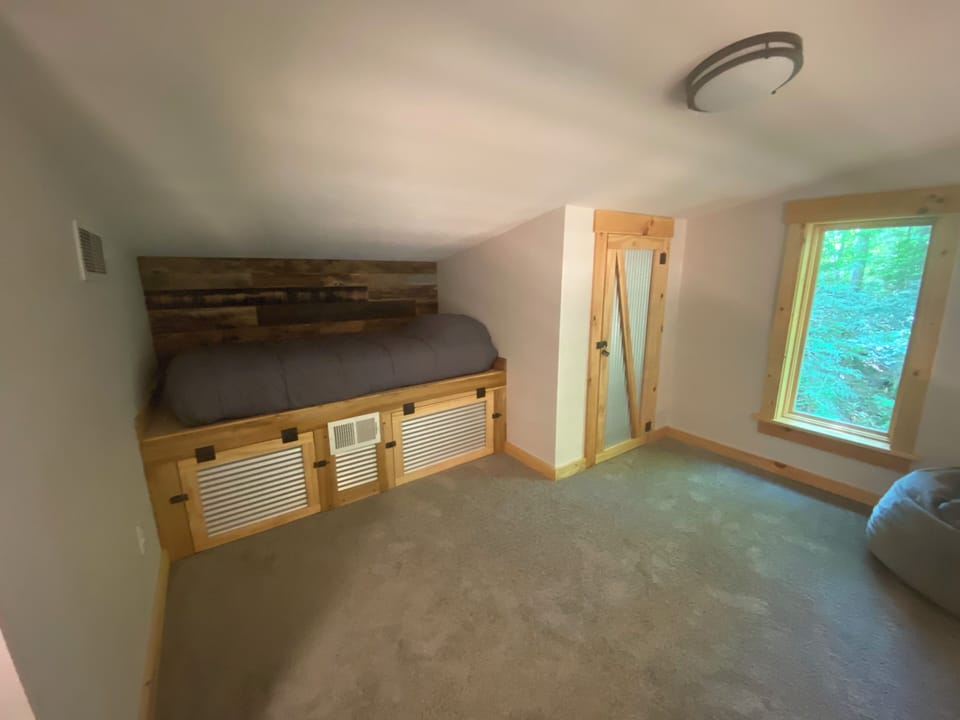 Twin bed (2 of 2) in ladder-accessed loft