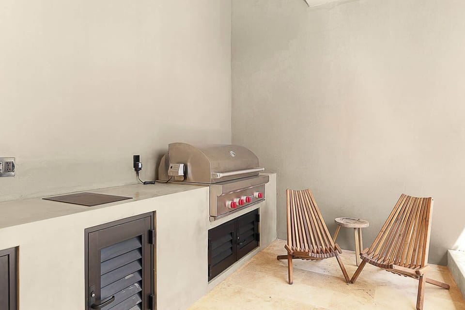 Courtyard living—BBQ grill, pizza oven, and sea air.