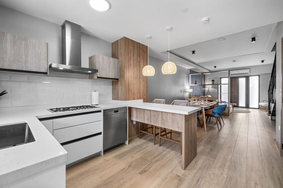 Love this open kitchen! It flows right into the dining area, making it perfect for cooking up a feast and enjoying meals with friends and family.