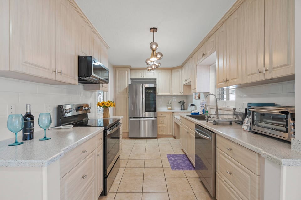 Fully equipped kitchen with modern appliances—ready for your culinary creations.