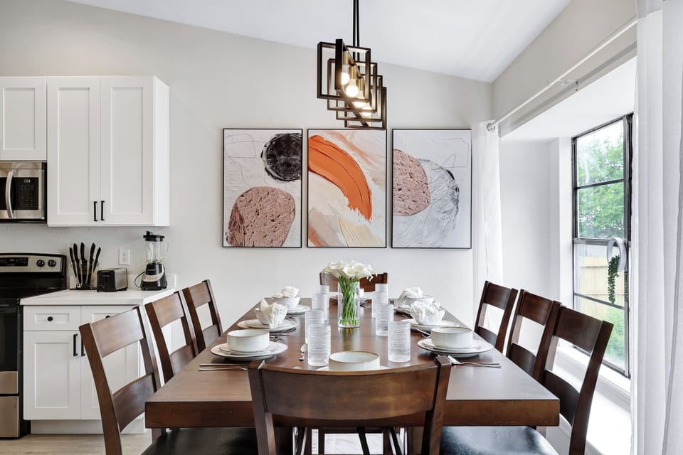 Spacious dining table that sits 8 with full tableware and silverware included.