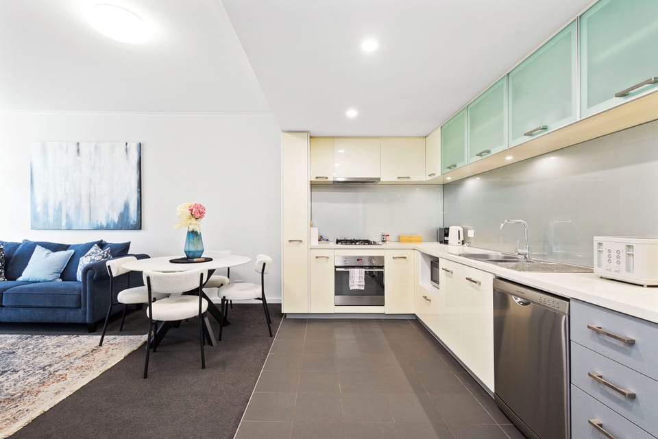 Appreciate the seamless flow between the comfortable living area, the inviting dining space, and the contemporary kitchen.