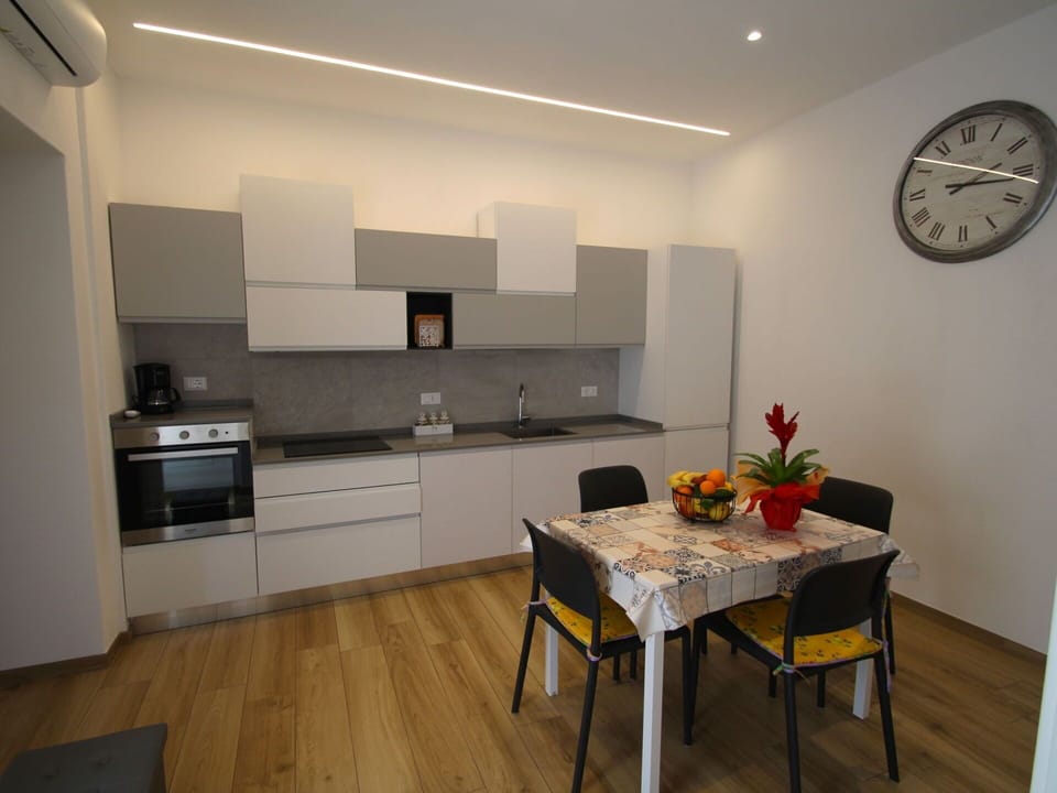 Furniture, Flooring, Interior Design, Wood, Floor, Kitchen, Countertop, Kitchen Appliance, Chair, Room