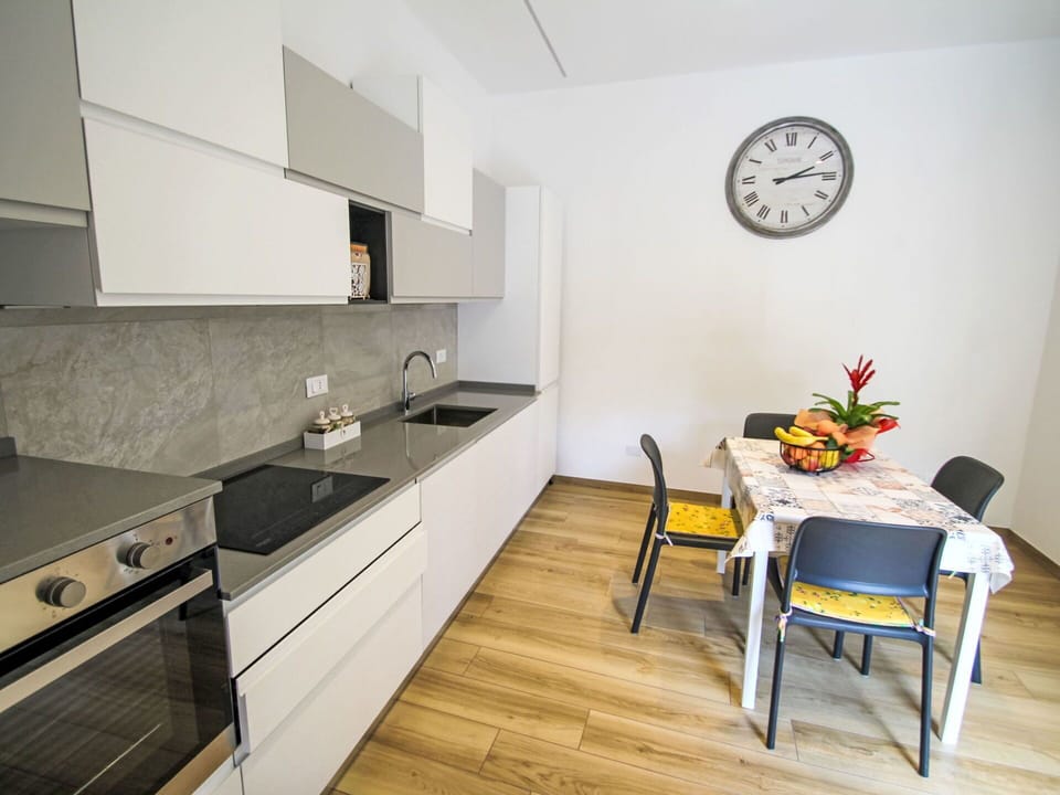 Flooring, Kitchen, Countertop, Furniture, Interior Design, Floor, Wood, Kitchen Appliance, Major Appliance, Cabinetry