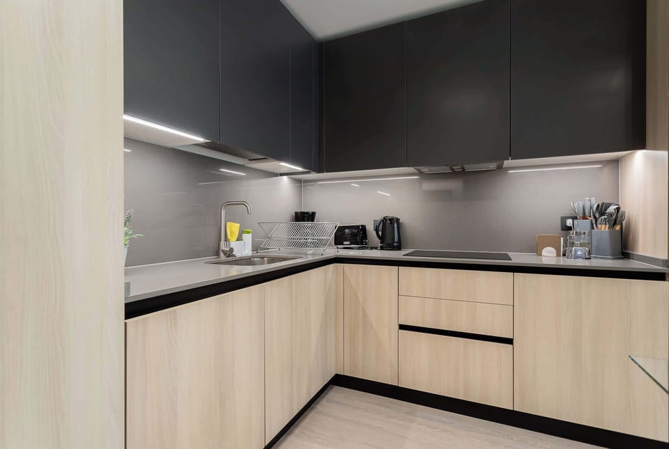 Sleek, modern kitchen with top-notch appliances, perfect for culinary adventures in your home away from home.