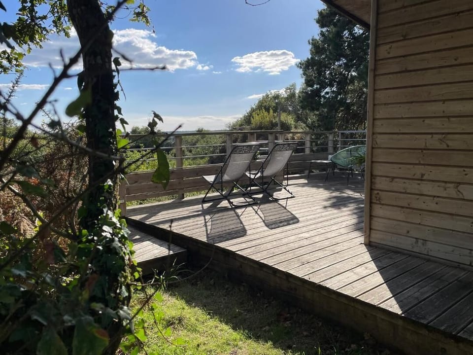 Enjoy the sun and the view overlooking the estate, village, and nature... that's what the Sépale cabin terrace promises.