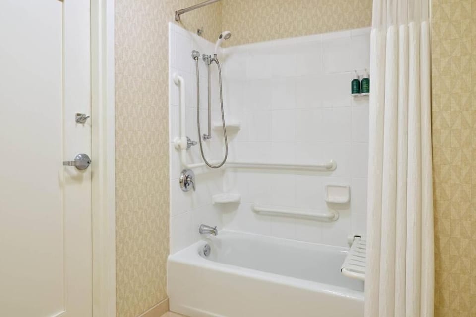 Refresh with a clean, accessible tub shower and bright finishes