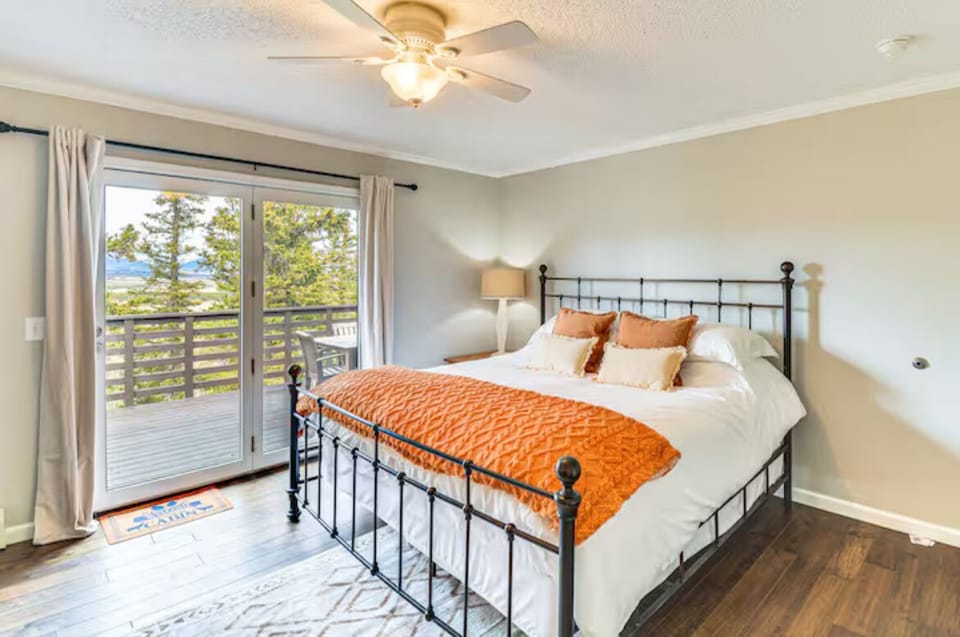 Master bedroom with access to big deck overlooking the property. 