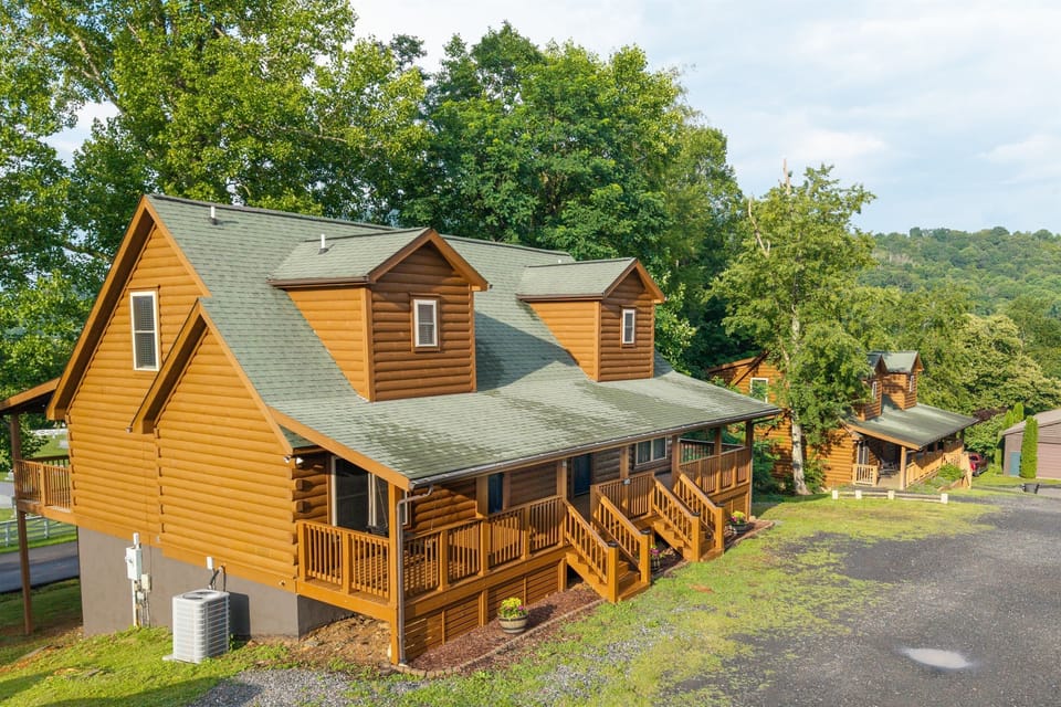 Welcome to your peaceful mountain retreat - two spacious log cabins side-by-side, offering 12 bedrooms and 12 baths, perfect for large gatherings.