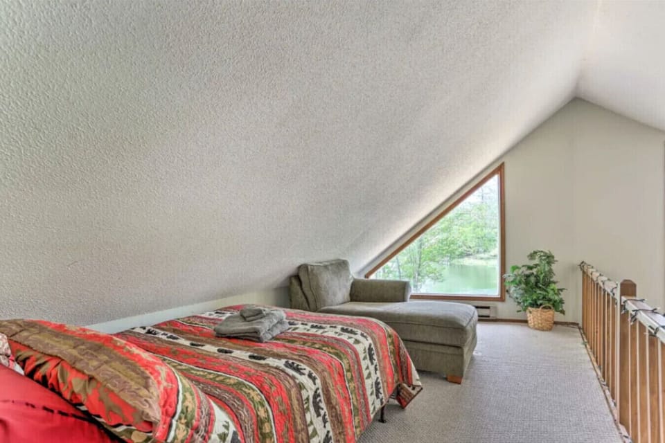 Loft space featuring a full-size bed, perfect for a comfortable stay
