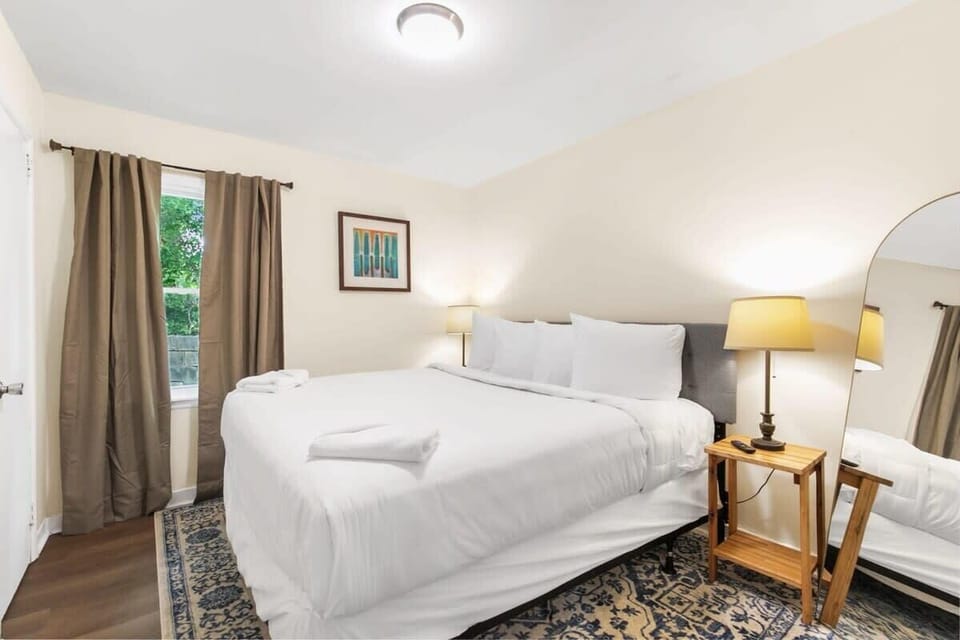 Minimalist Bedroom with bedside lamp and mirror
