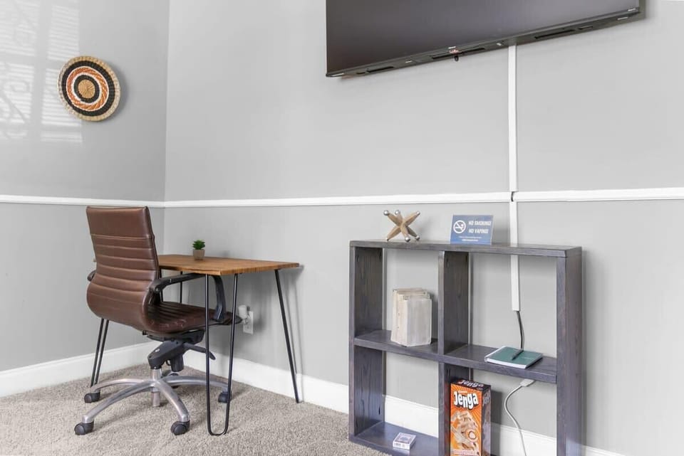 Living room space has a desk for work or study
