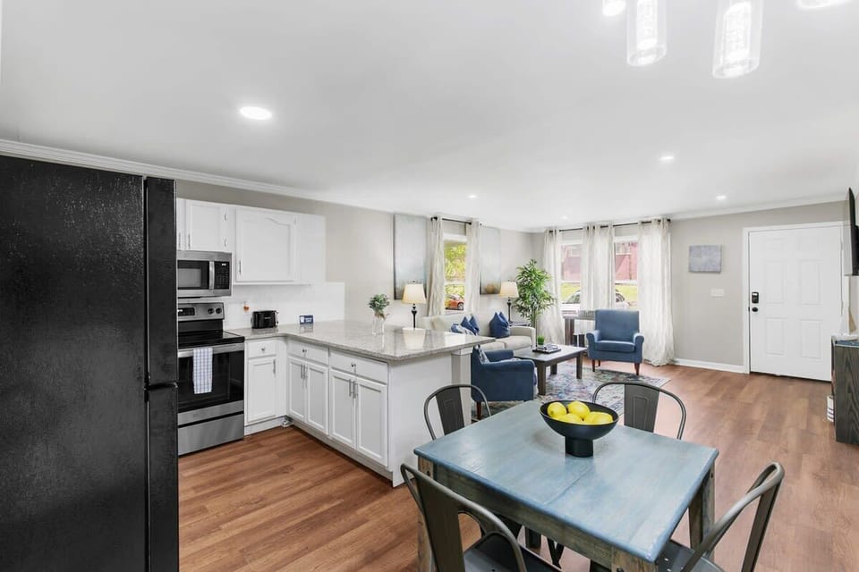 Dining table, kitchen, and living room