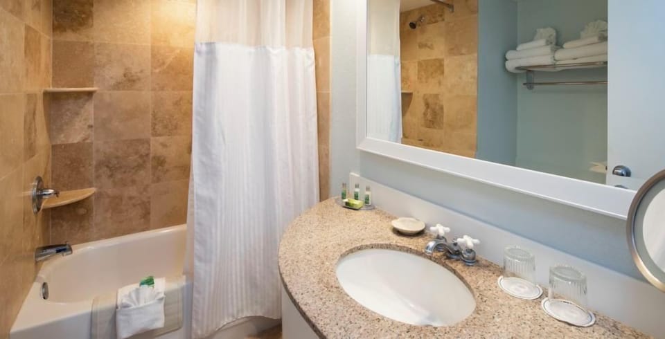 Get ready with a wide vanity and bright, clean mirror.