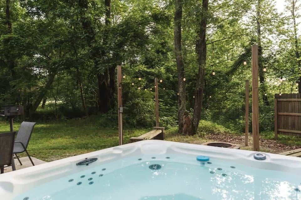 Soak your worries away in the outdoor hot tub surrounded by peaceful forest views