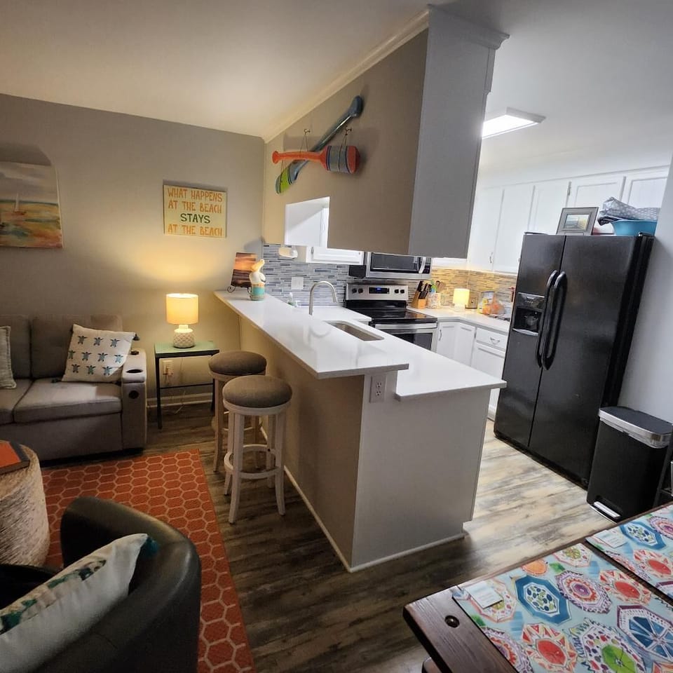 Living room and well appointed kitchen. 