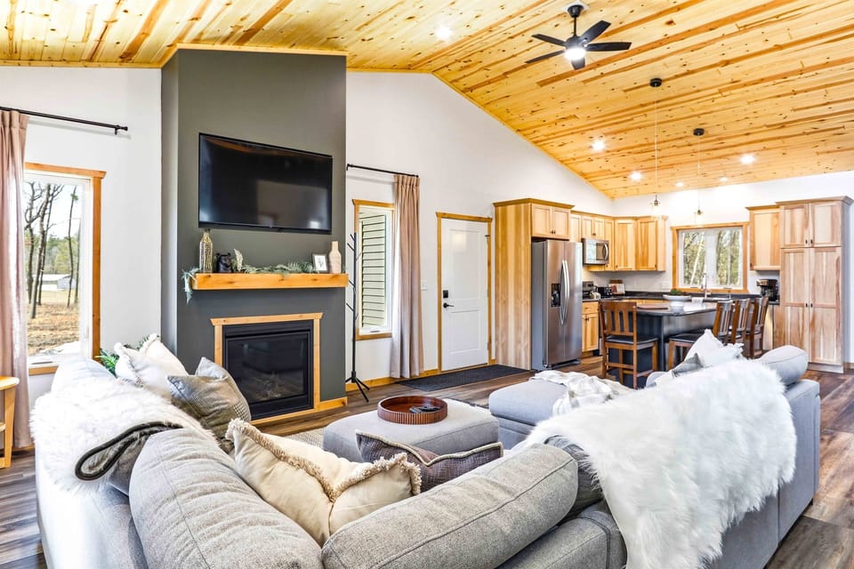 Open plan means the cook stays in the conversation. Living room, kitchen, and dining all visible from one spot — the group never splits when the space flows this well.