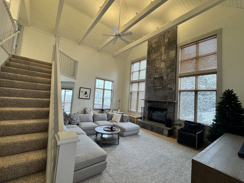 Living rm with huge wood burning fireplace & 60" Smart TV