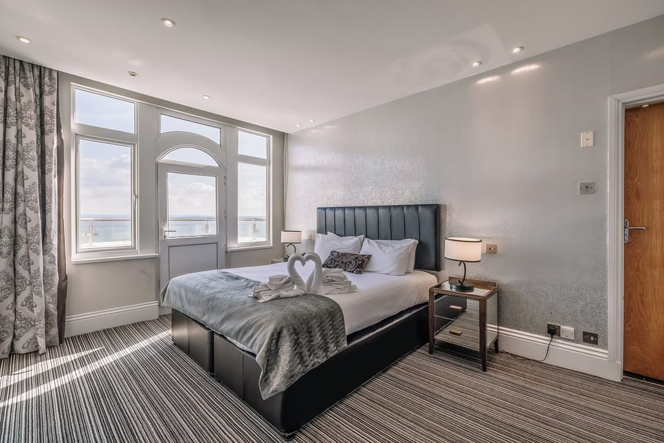 Wake up to sunshine and calming coastal views from bed.