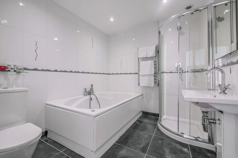 Refresh in a sleek bathroom with both tub and shower