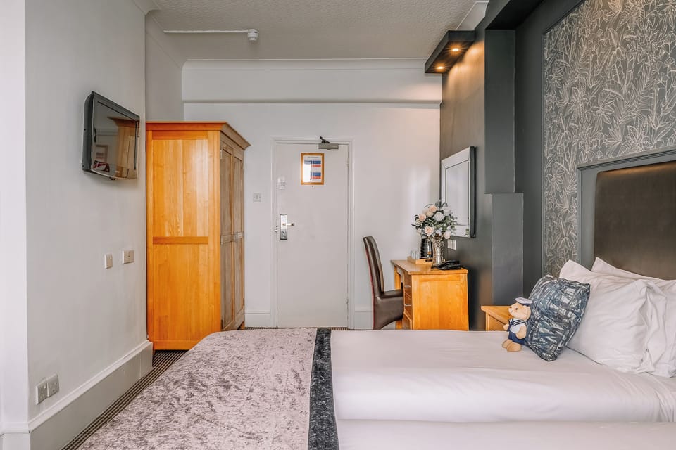 Arrive and feel at home with storage, TV, and cozy bedding