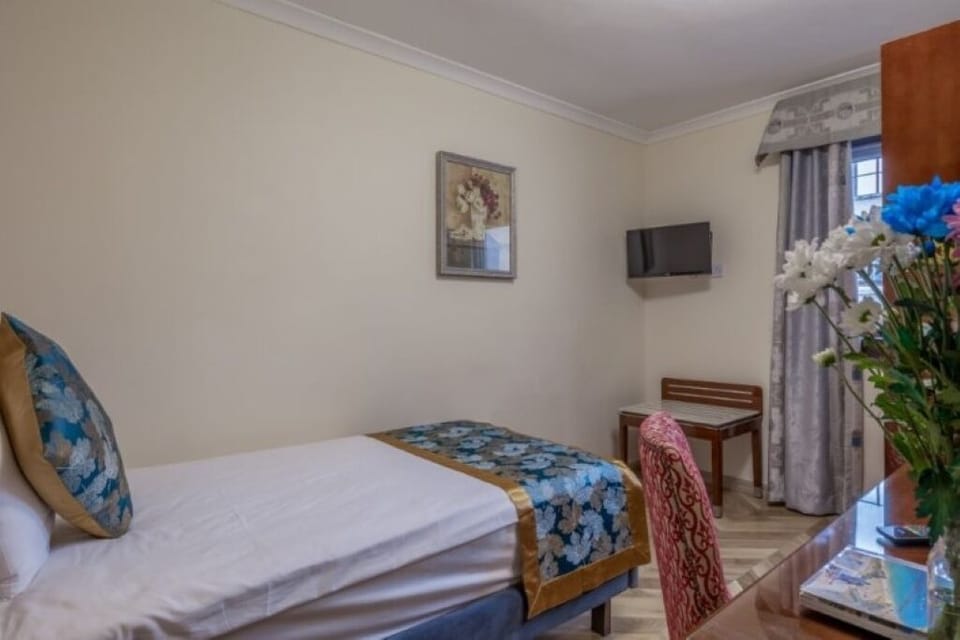 Stretch out in a quiet single room with in-room TV.