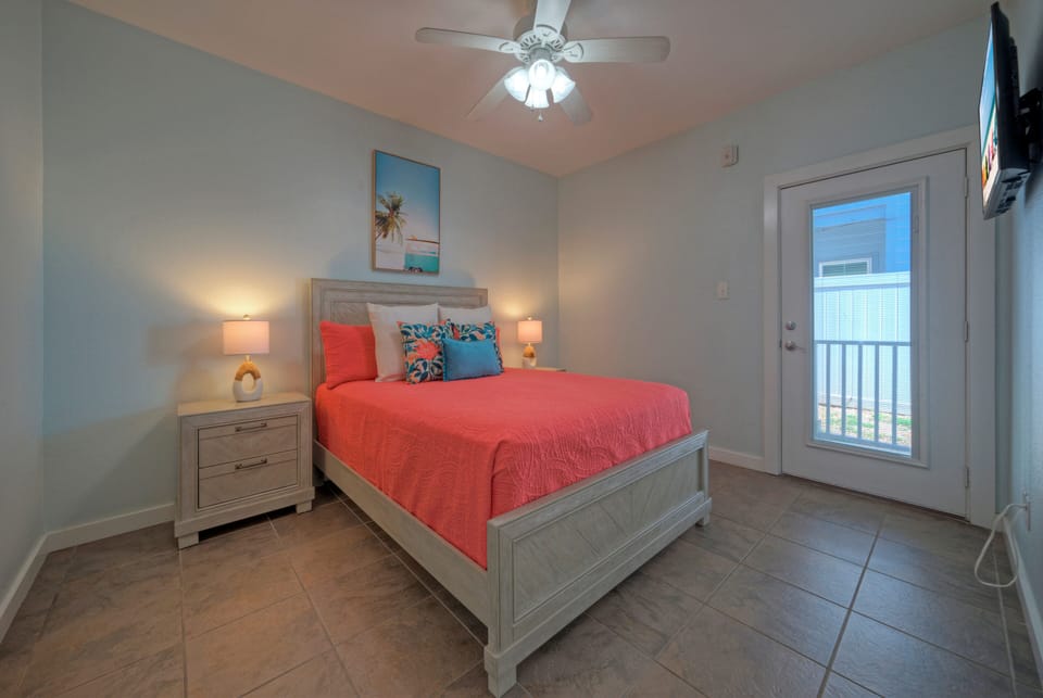 Bedroom 2 features a queen bed and an ensuite bathroom (Unit 107)