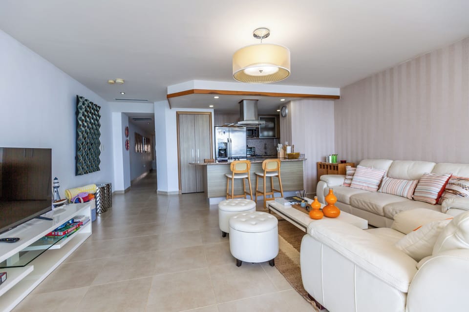 Beachfront Living Room – Relax with A/C, Smart TV, and ocean views — your cozy corner by the beach.


